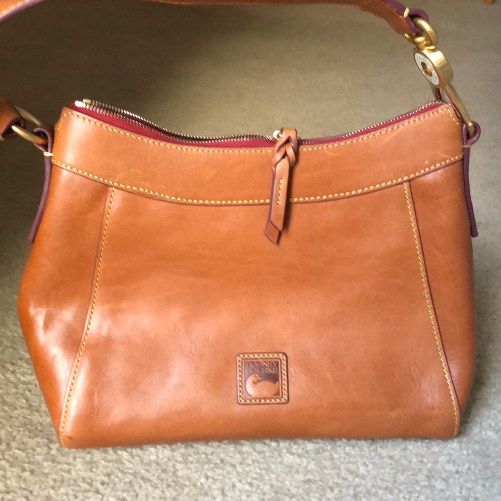 Dooney & Bourke purse! Genuine leather. Camel/whiskey color. Like new!